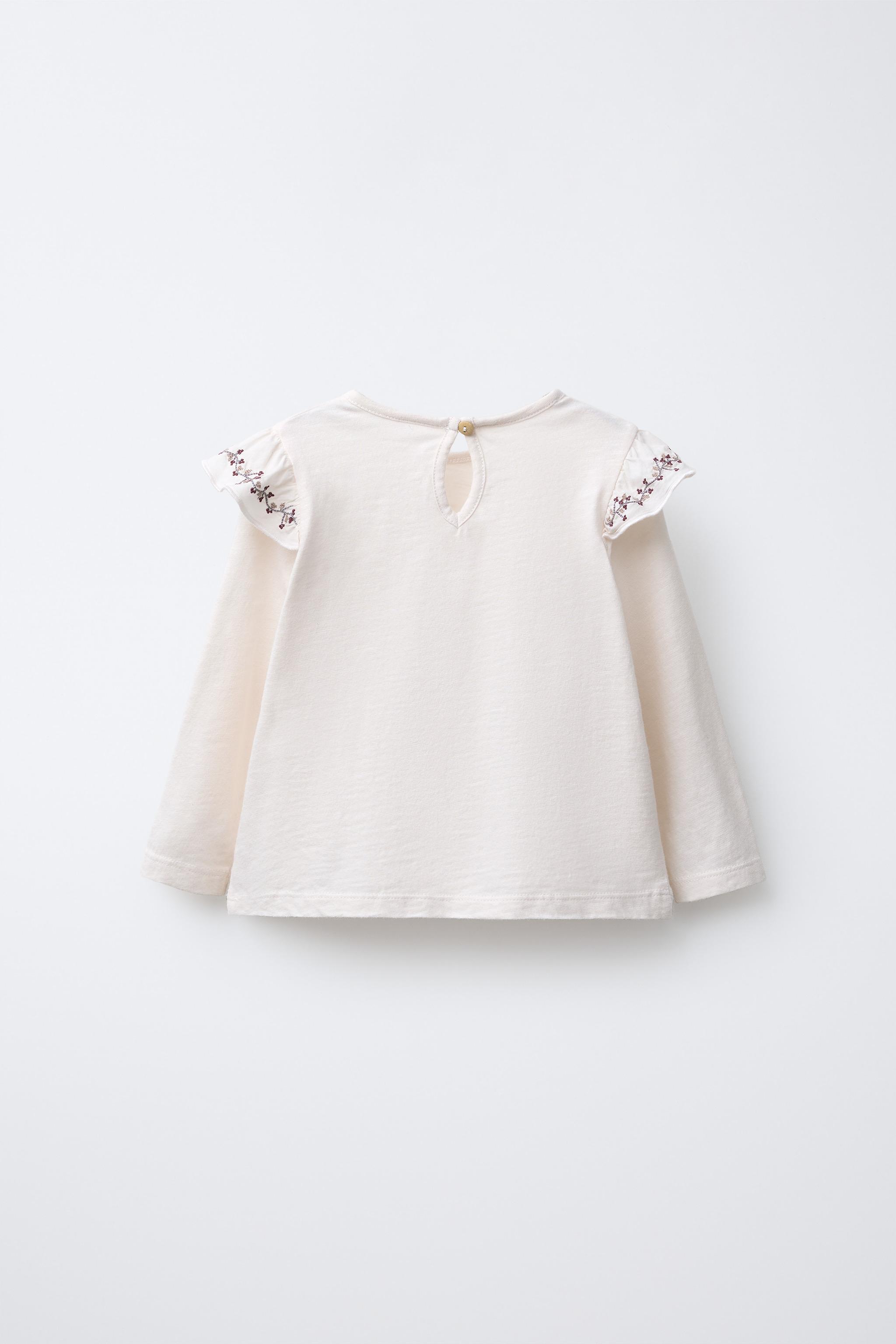 HAUT À VOLANT FLEURS BRODÉES